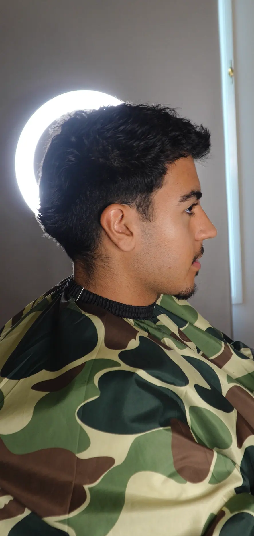 Grown-out sides before a taper fade at Quavious Cuts